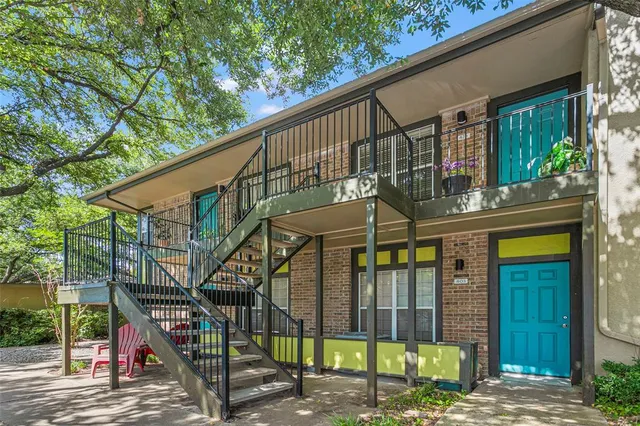 a view of house with a swimming pool