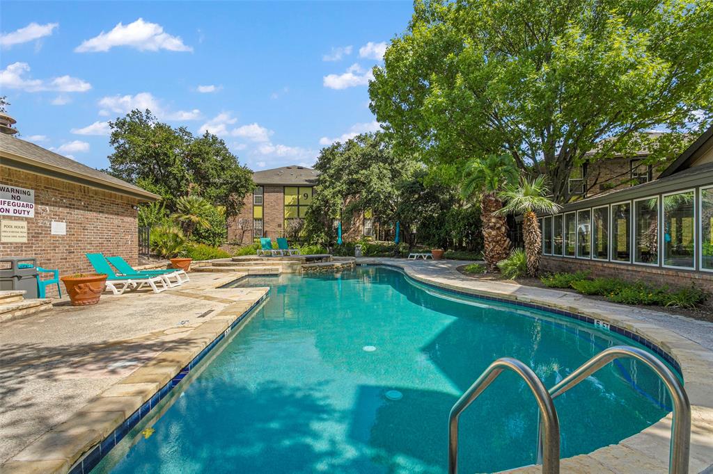 7685 Northcross Drive, Unit 423 Austin, TX 78757 - Photo 18 of 20 a view of a house with swimming pool