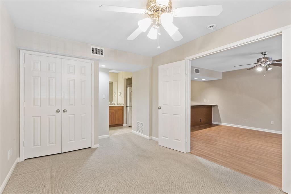 7685 Northcross Drive, Unit 423 Austin, TX 78757 - Photo 5 of 20 an empty room with fan and entrance