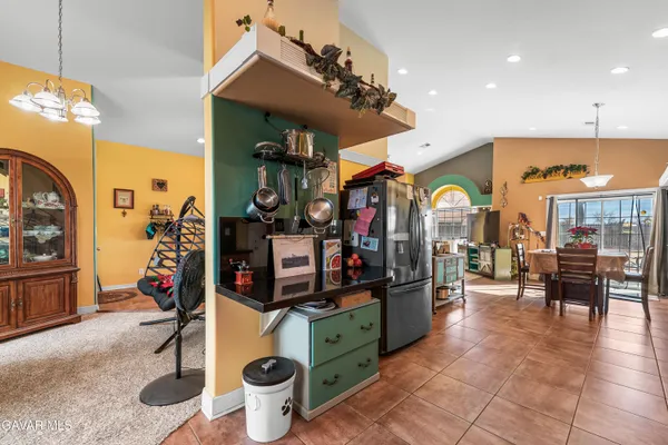 a view of a chairs and tables in a room