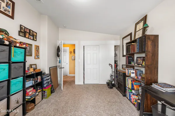 a view of a livingroom with furniture and toys
