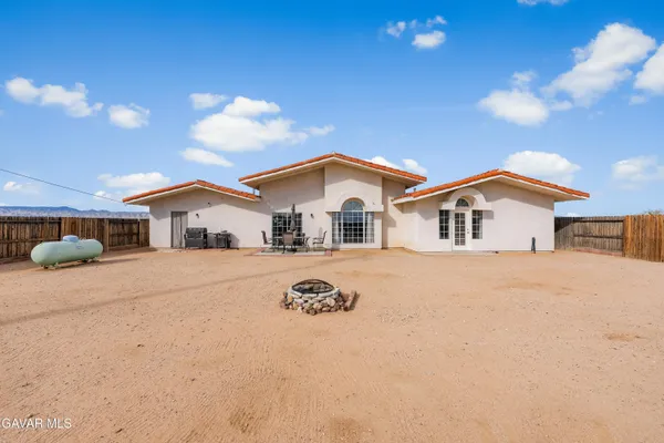 a view of house with yard
