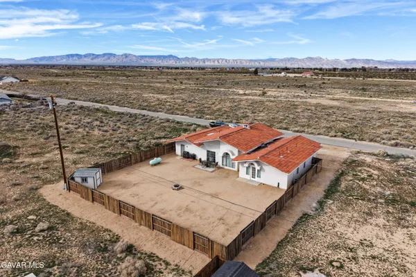 a view of a terrace with wooden floor and lake view