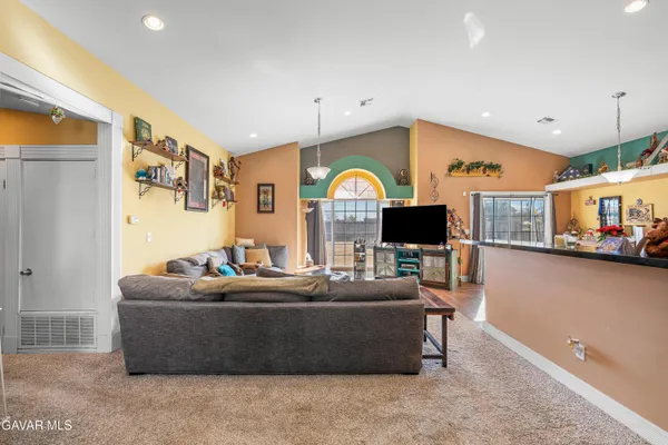 a living room with furniture and a large window
