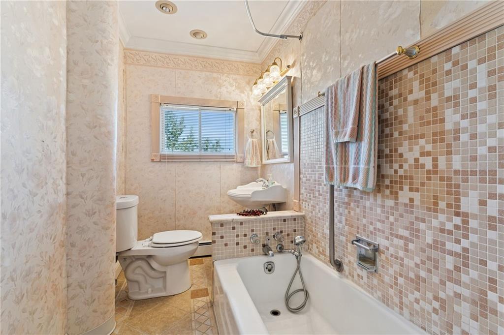 28 Gregory Street Pittsburgh, PA 15203 - Photo 17 of 44 a bathroom with a sink toilet and shower