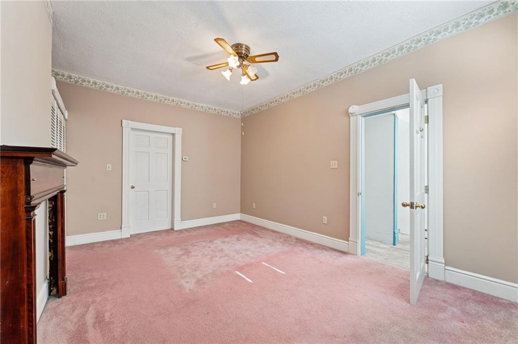 28 Gregory Street Pittsburgh, PA 15203 - Photo 24 of 44 a view of an empty room with a chandelier fan