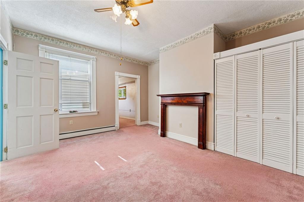 28 Gregory Street Pittsburgh, PA 15203 - Photo 25 of 44 a view of an empty room with a fireplace