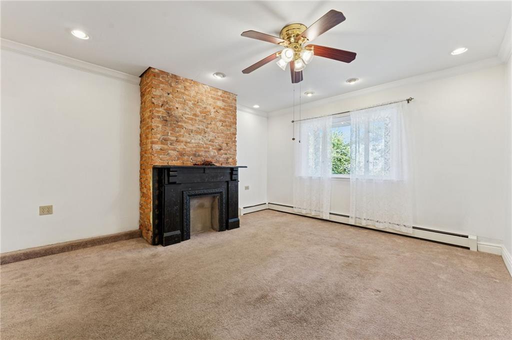 28 Gregory Street Pittsburgh, PA 15203 - Photo 27 of 44 an empty room with windows and fireplace