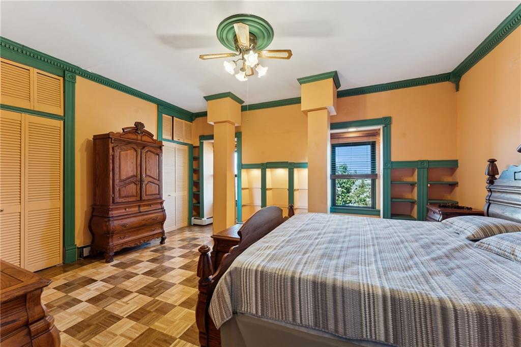 28 Gregory Street Pittsburgh, PA 15203 - Photo 30 of 44 a bedroom with a bed dresser and a window