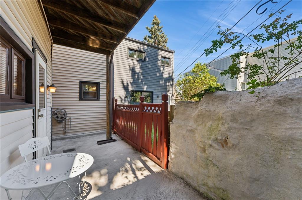 28 Gregory Street Pittsburgh, PA 15203 - Photo 37 of 44 a view of a house with a chairs in patio