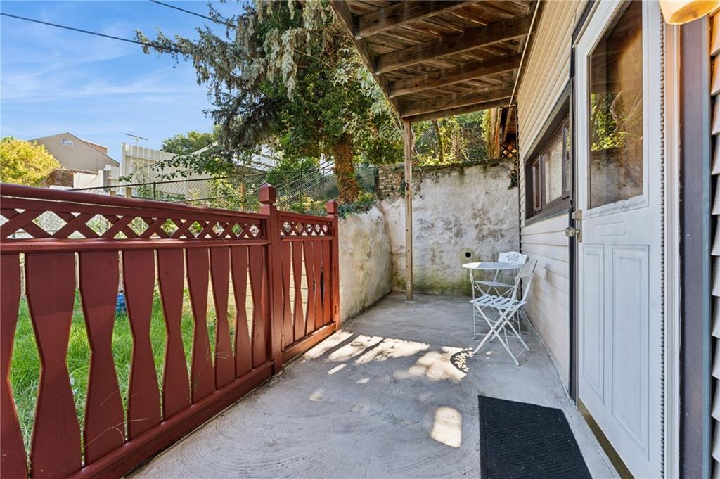 28 Gregory Street Pittsburgh, PA 15203 - Photo 38 of 44 a view of an outdoor space with wooden fence