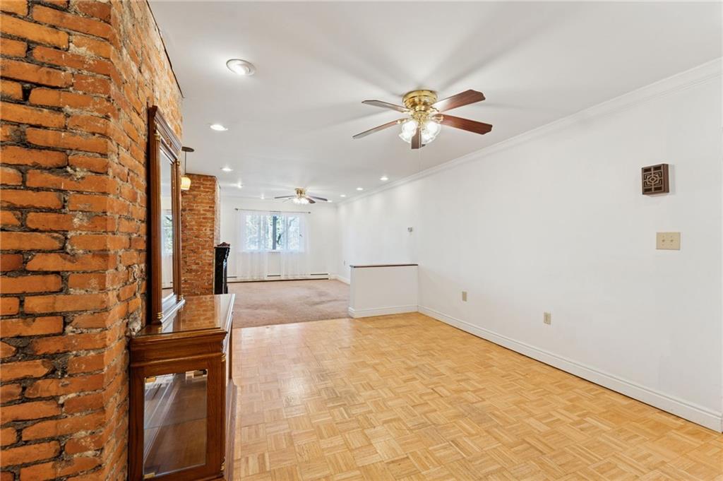 28 Gregory Street Pittsburgh, PA 15203 - Photo 10 of 44 a view of a livingroom with a ceiling fan and a rug