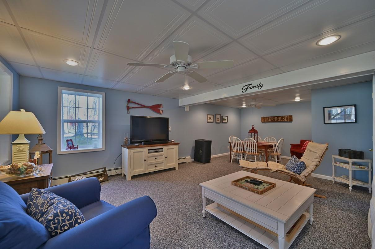 76 Rockway Road Lake Ariel, PA 18436 - Photo 68 of 101 a living room with furniture a flat screen tv and a window