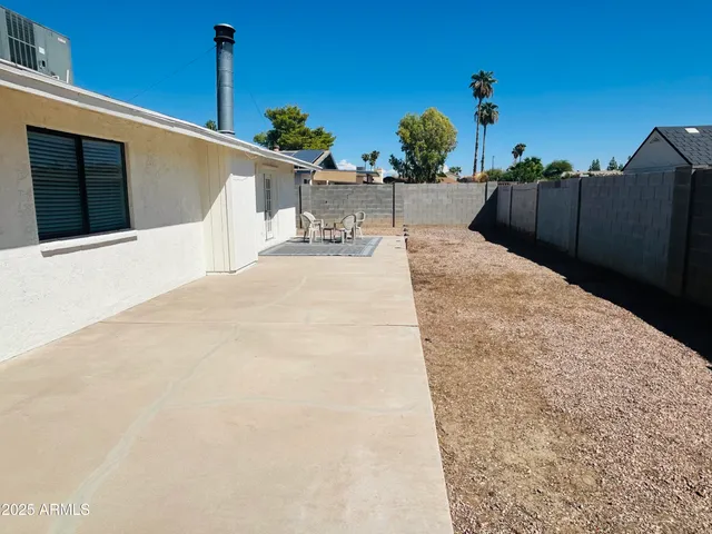 a view of a terrace with chairs
