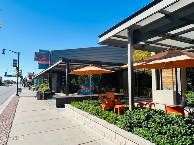 a view of a building with traffic signal lights