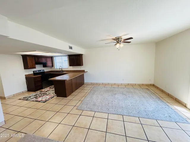 a view of a kitchen with a sink