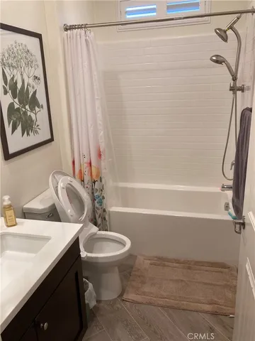 a bathroom with a sink a toilet and a bathtub