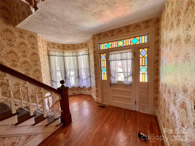 a bedroom with a bed and a fireplace