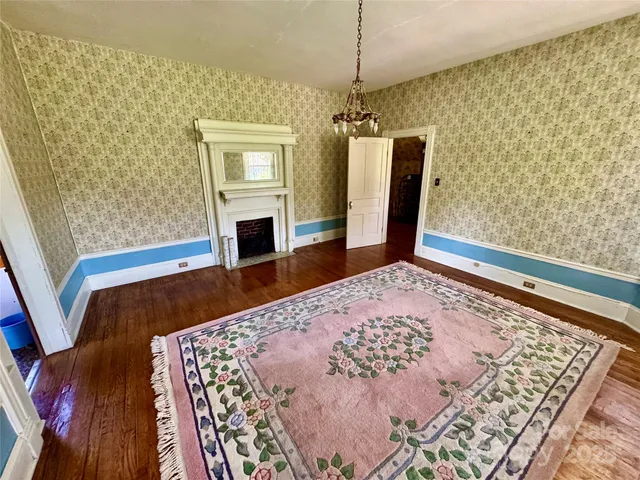 a view of a dining room with furniture and a window