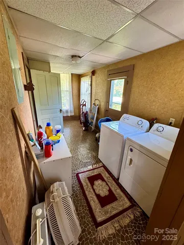 a living room with a fireplace and a table