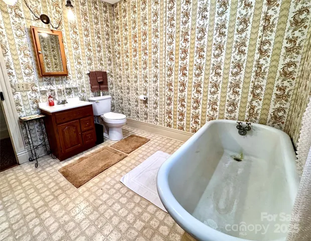 a view of an empty room with a fireplace