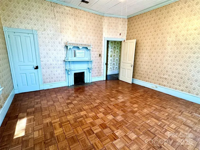 a bathroom with a toilet and a shower curtain