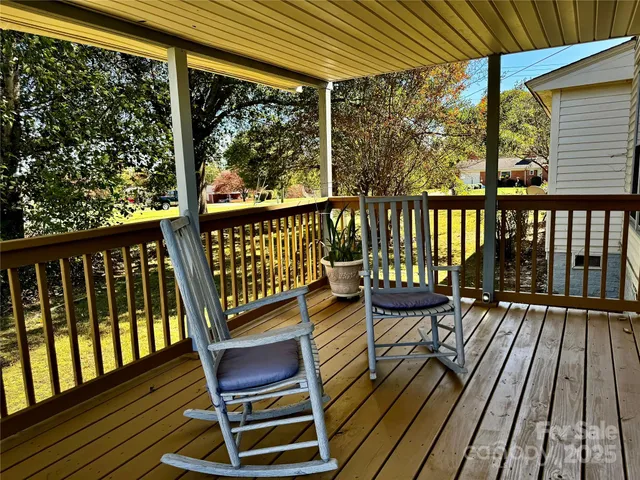 a view of a two chairs in the balcony