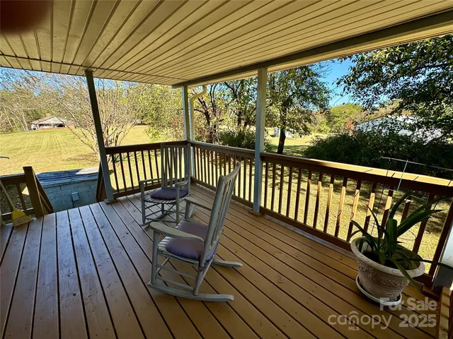 a view of balcony with wooden floor