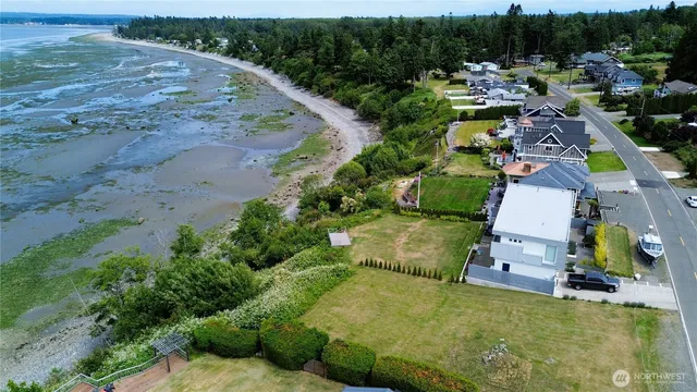 an aerial view of a house with a yard