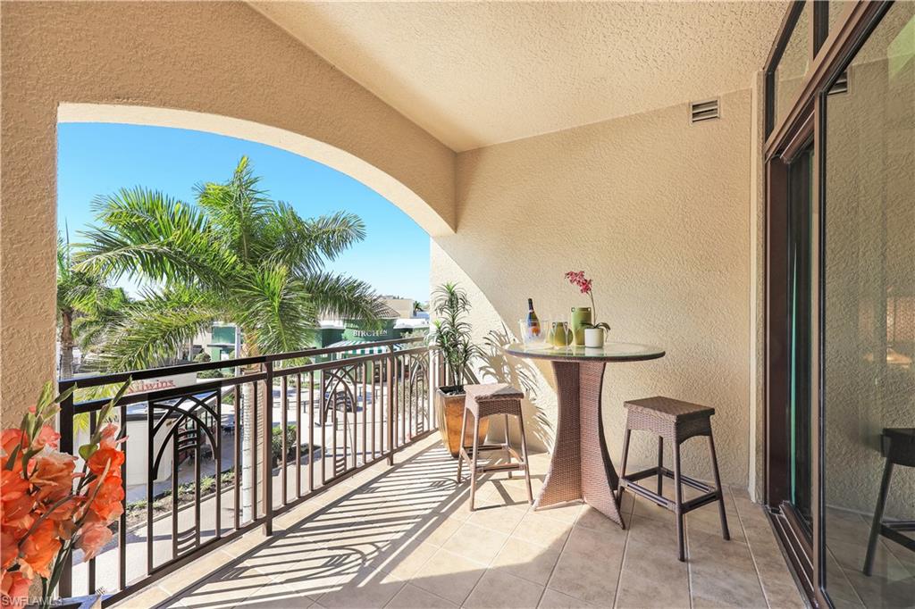 9115 Strada Place, Unit 5314 Naples, FL 34108 - Photo 11 of 44 a view of a balcony with furniture