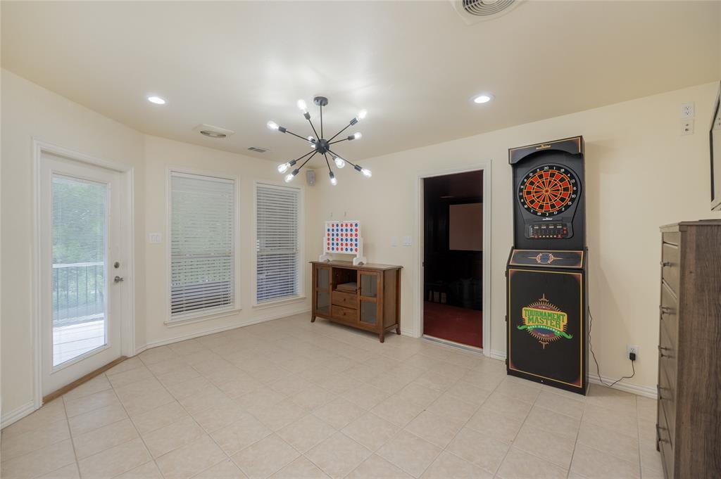 135 Kirkpatrick Road Ennis, TX 75119 - Photo 26 of 40 a view of an empty room with window and cabinet
