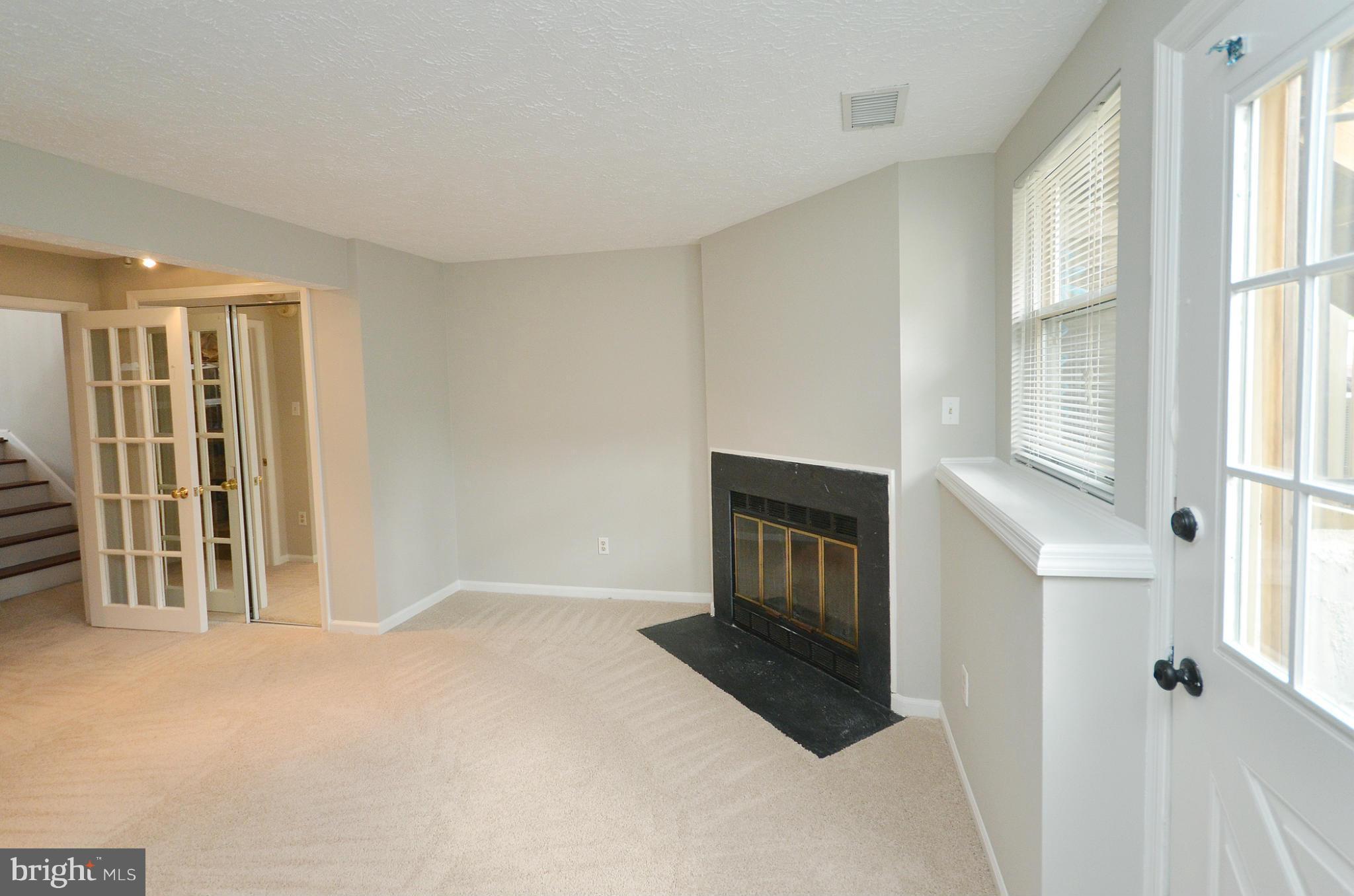 1617 Fieldthorn Drive Reston, VA 20194 - Photo 19 of 30 Basement family room w/ woodburning fireplace