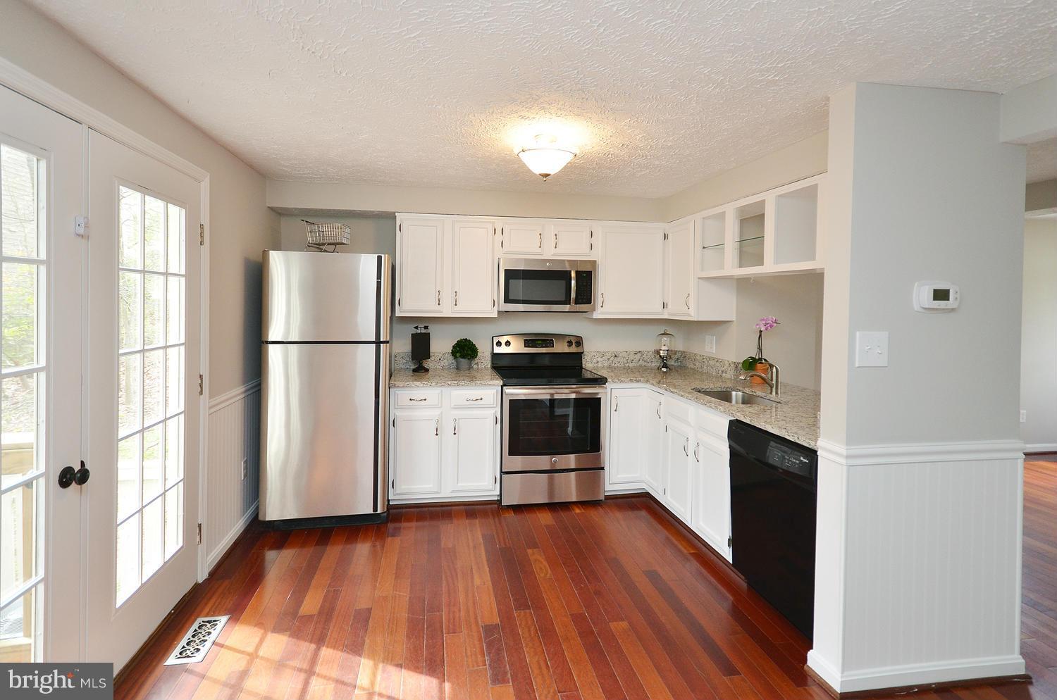 1617 Fieldthorn Drive Reston, VA 20194 - Photo 8 of 30 Updated kitchen w/ SS fridge, micro, range & HWF