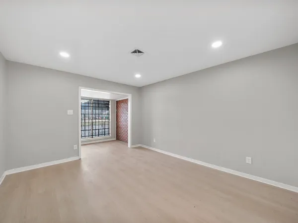 a view of an empty room with a window