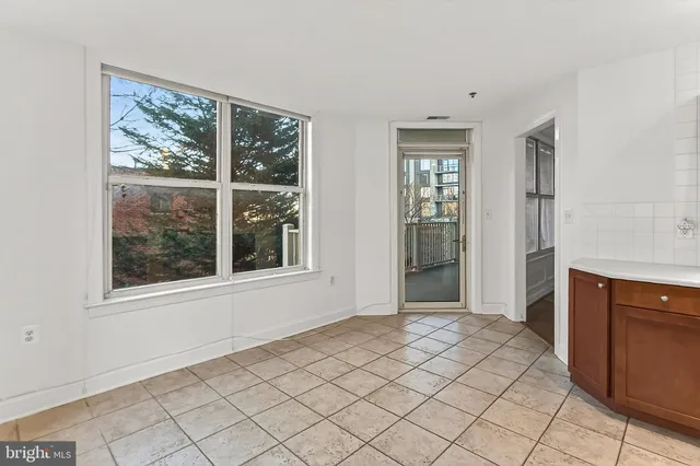 a bedroom with a bed and a television