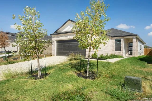 a house view with a garden space