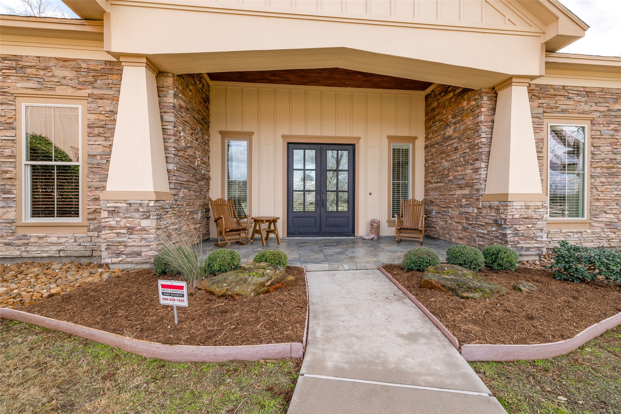 31102 Lower Oxbow Trace Fulshear, TX 77441 - Photo 4 of 50 Recently fitted gorgeous double wrought iron front doors & sit on your rocking chairs on covered patio to enjoy this beautiful quiet countryside setting