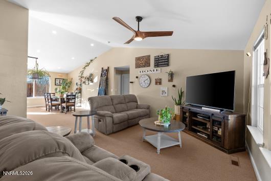 552 Spur Court Fernley, NV 89408 - Photo 9 of 46 a living room with furniture and a flat screen tv