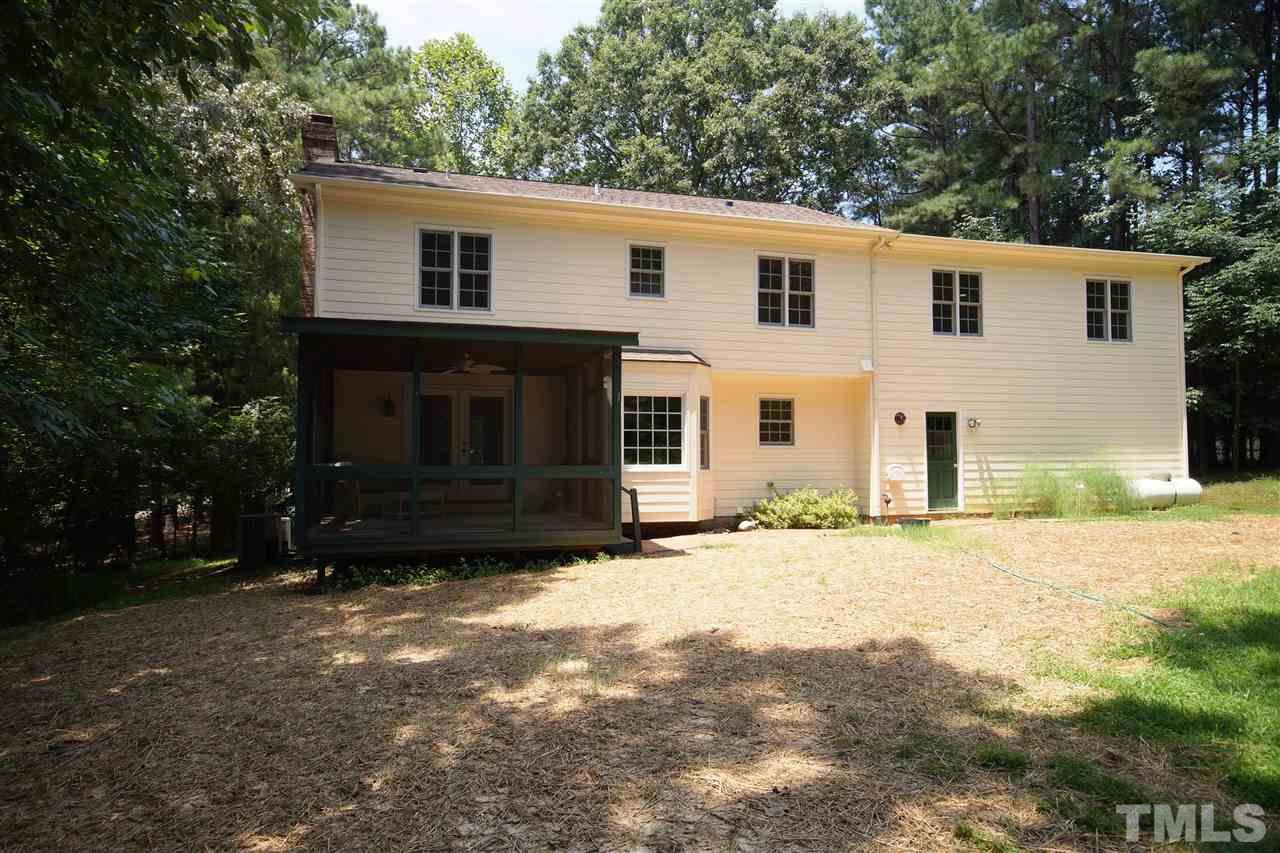 10708 Marthas Way Raleigh, NC 27615 - Photo 22 of 24 a view of a house with a yard