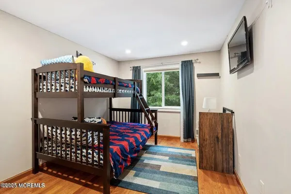 a bedroom with furniture and a window