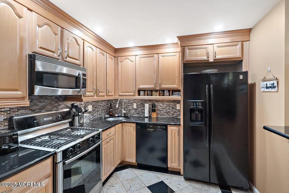 11 Desiree Court Howell, NJ 07731 - Photo 6 of 23 a kitchen with a refrigerator stove and cabinets