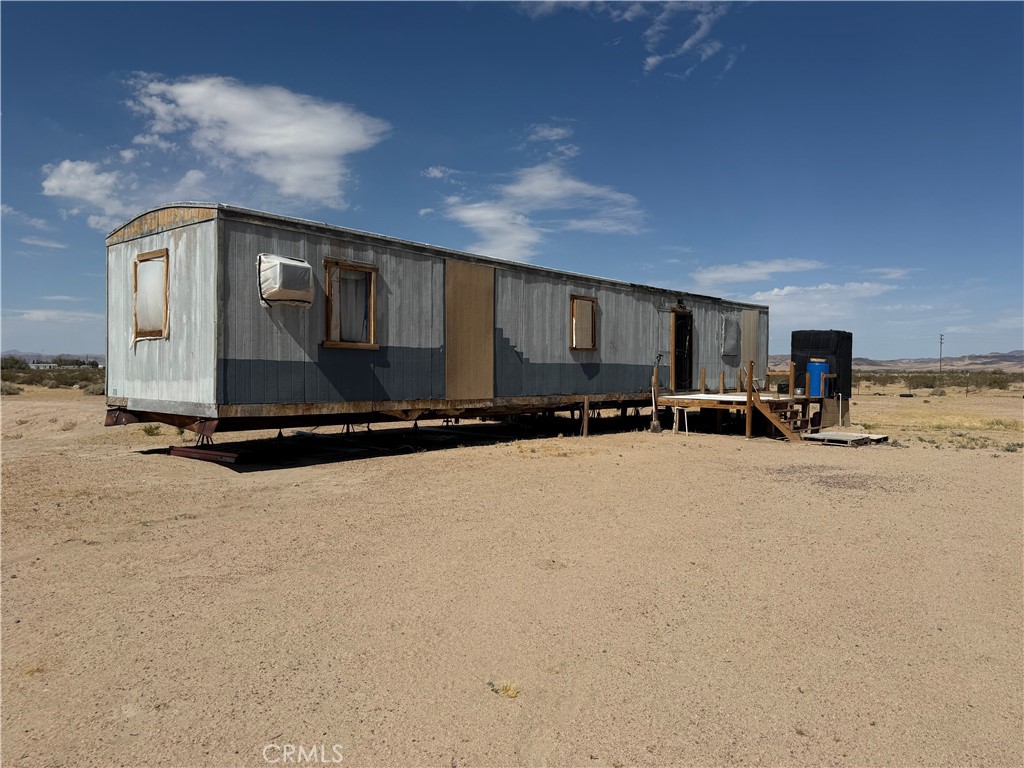 35030 Harvard Road Newberry Springs, CA 92365 - Photo 2 of 23 a view of a car park in front of house