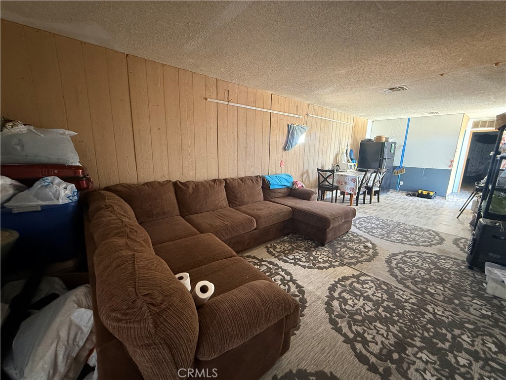 35030 Harvard Road Newberry Springs, CA 92365 - Photo 6 of 23 a living room with furniture and a wooden floor