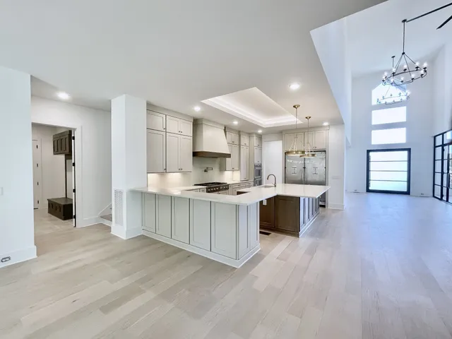 a large bathroom with a double vanity sink and mirror