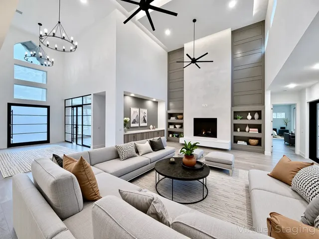 a kitchen with stainless steel appliances granite countertop a kitchen island a stove a sink and a microwave