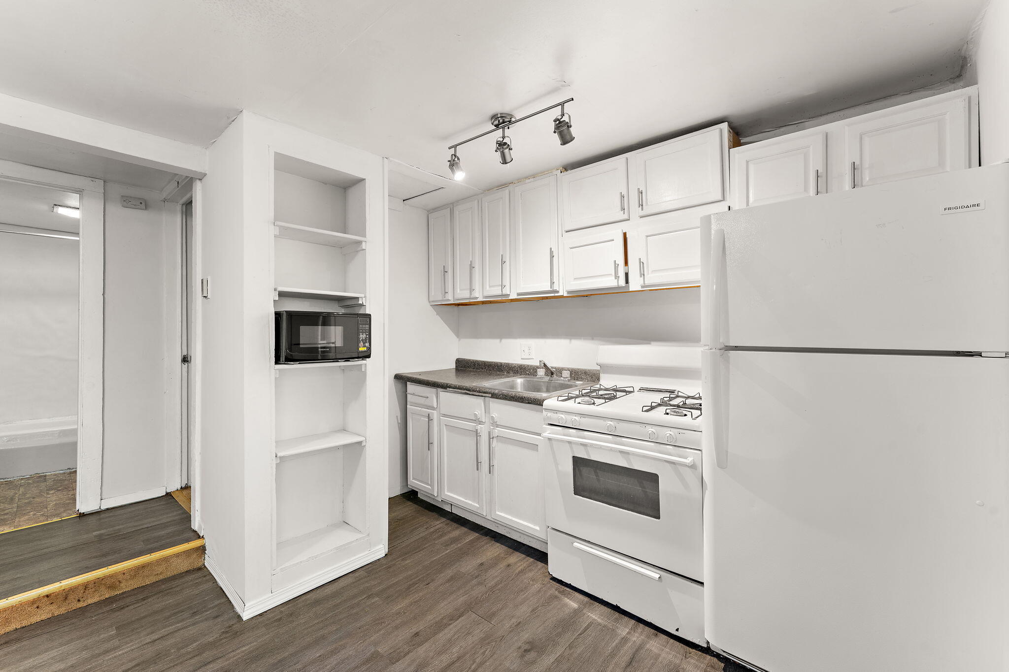 1910 South Calhoun Street Griffith, IN 46319 - Photo 16 of 34 a kitchen with cabinets appliances and wooden floor