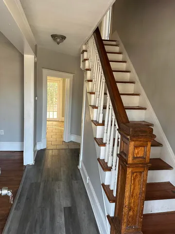 a view of an entryway with wooden floor