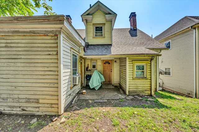 a front view of a house with parking area