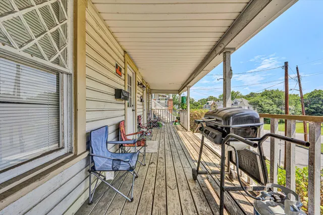a view of a balcony with chairs