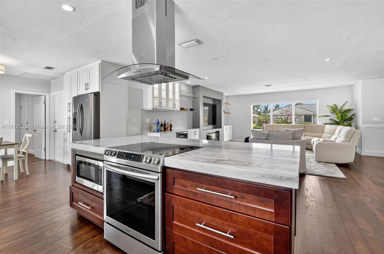 5660 Golfway Drive Boca Raton, FL 33433 - Photo 14 of 41 a kitchen with a stove and cabinets